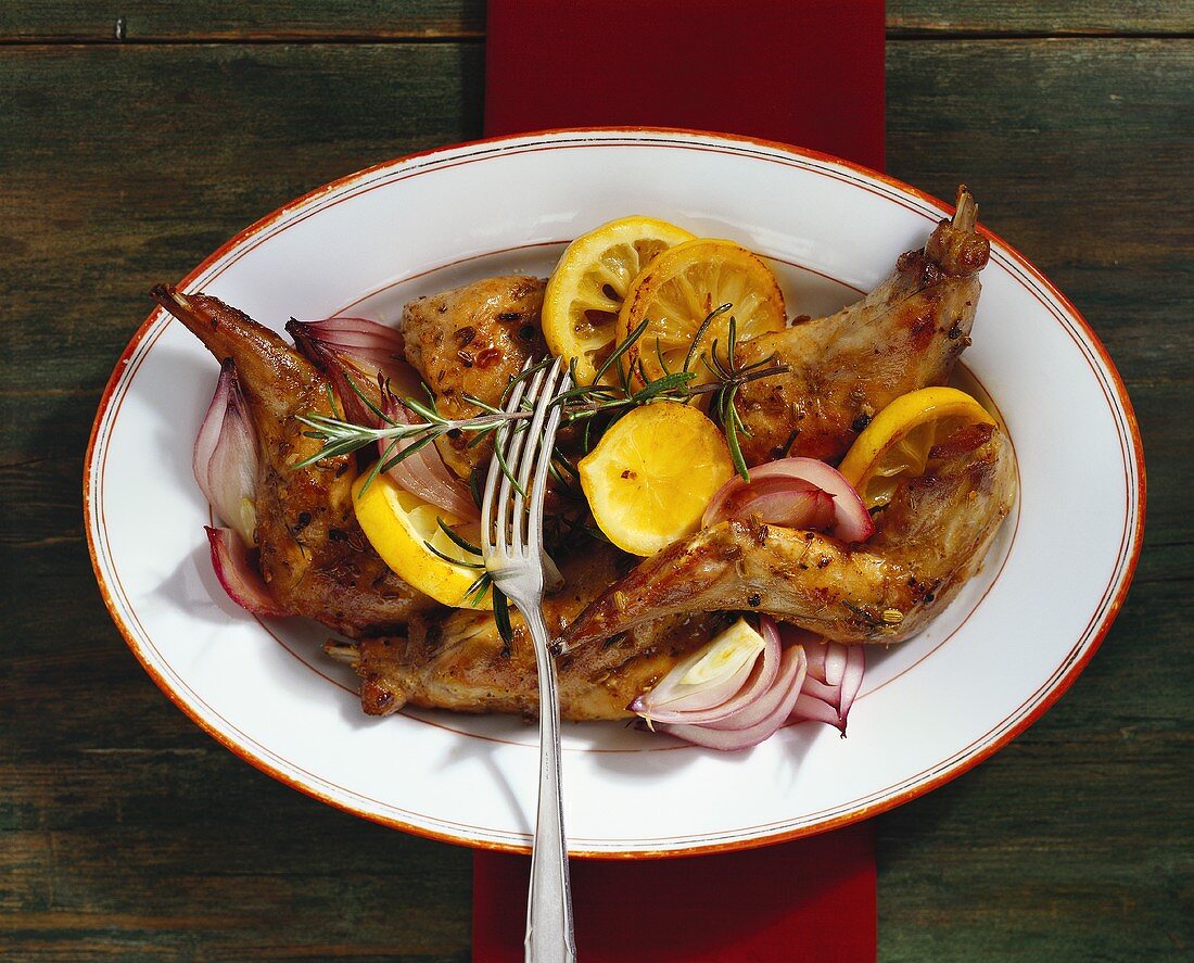 Braised rabbit with lemons and red onions