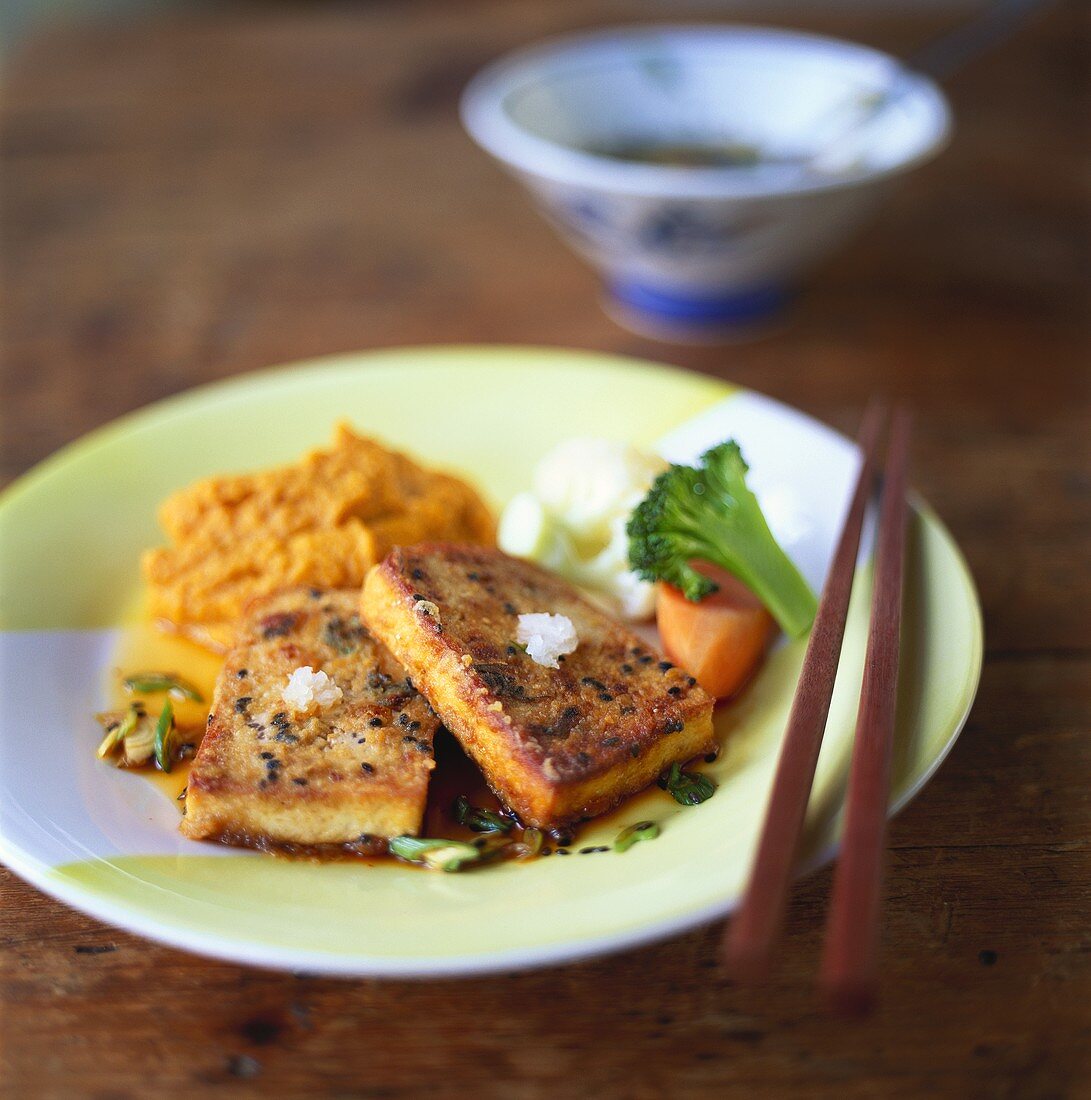 Fried smoked sesame tofu with red lentil puree