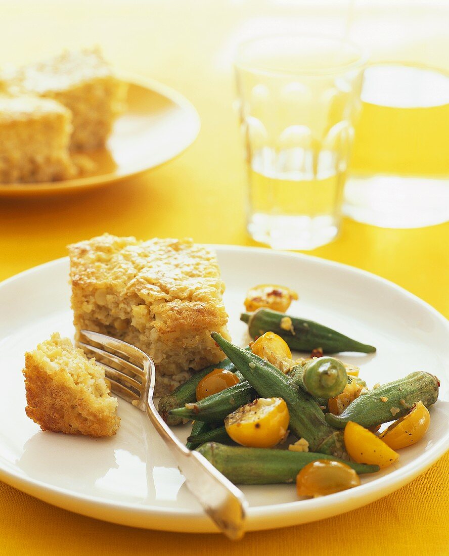 Okra salad with yellow cherry tomatoes; corn bread