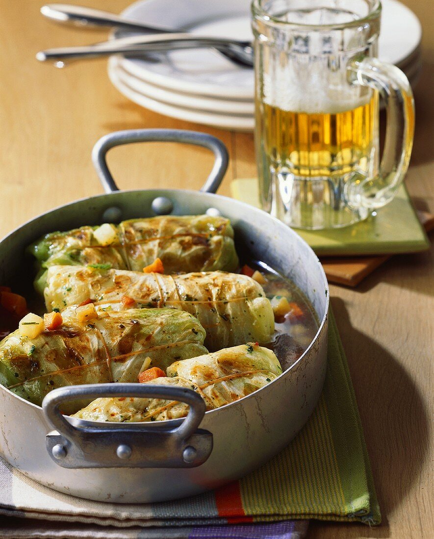 White cabbage roulades with mince filling; beer