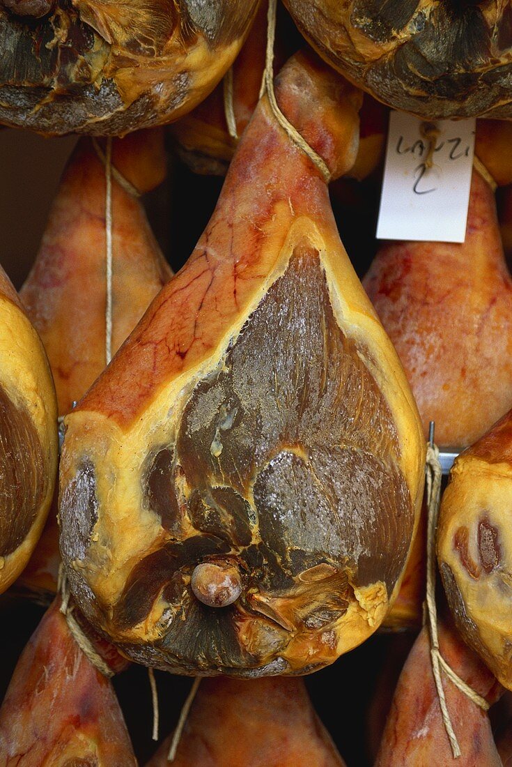 Various hams from Italy, hanging in shop