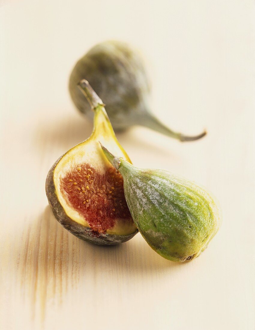 Fresh figs on wooden background