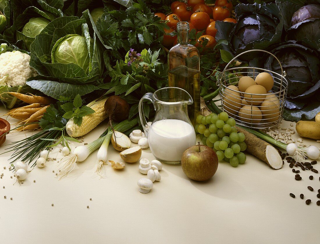 Still life: vegetables, fruit, olive oil, eggs, milk etc.