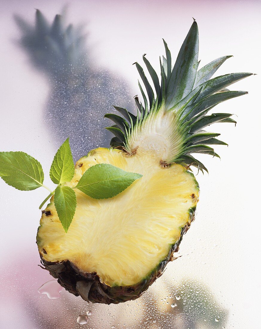 Halved pineapple with pineapple sage