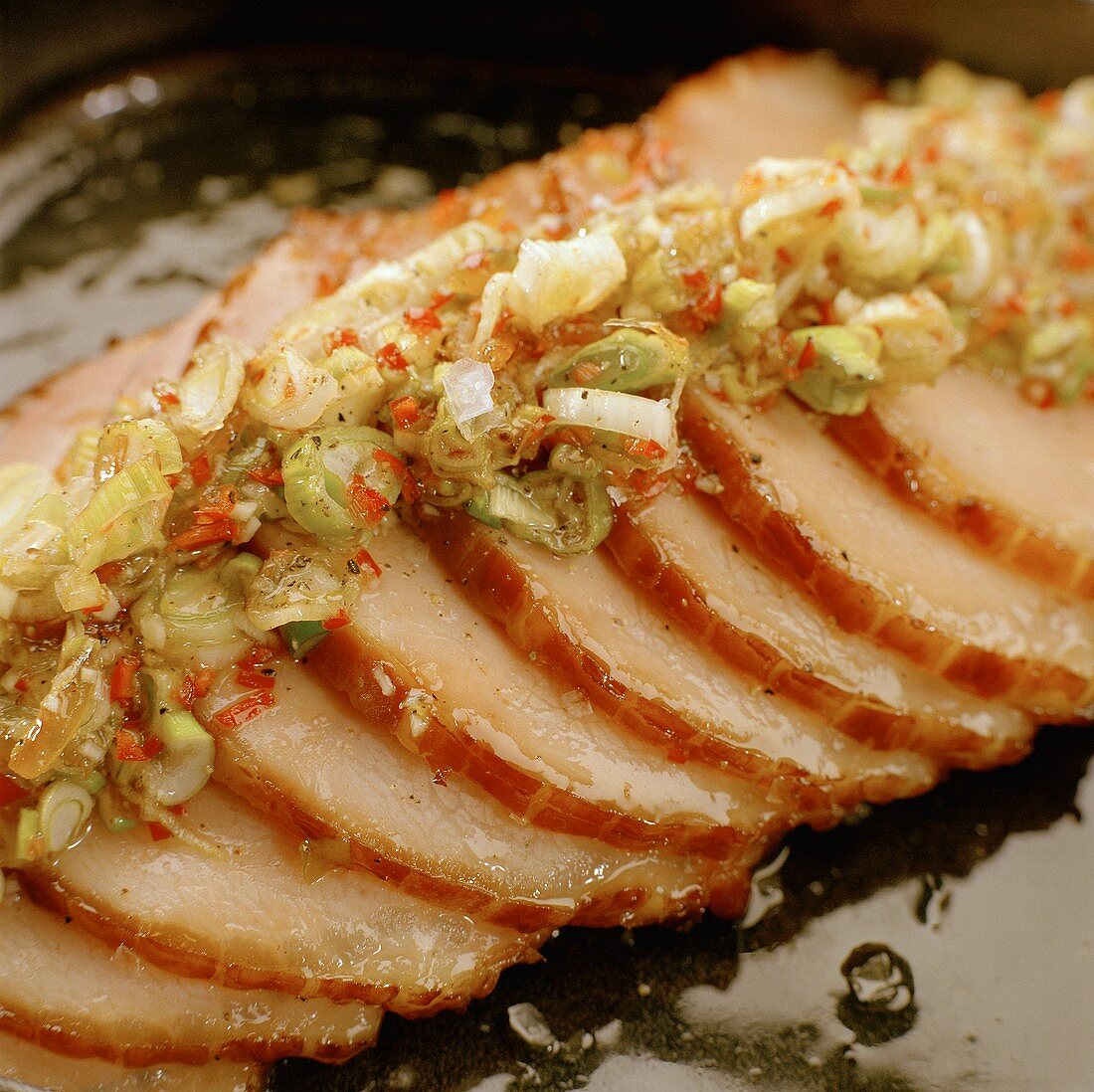 Sliced roast pork with spring onions and chili