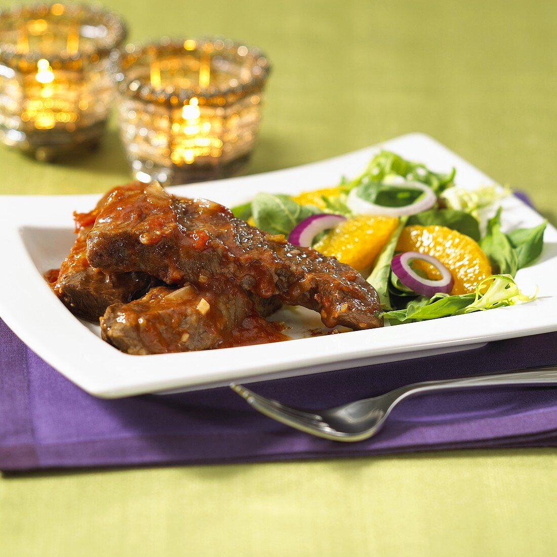Ribs with spicy sauce and salad