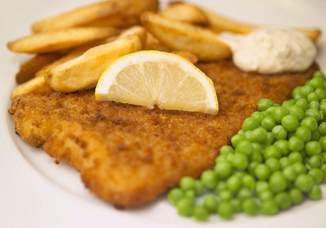 Breaded plaice with fries, peas and tartare sauce