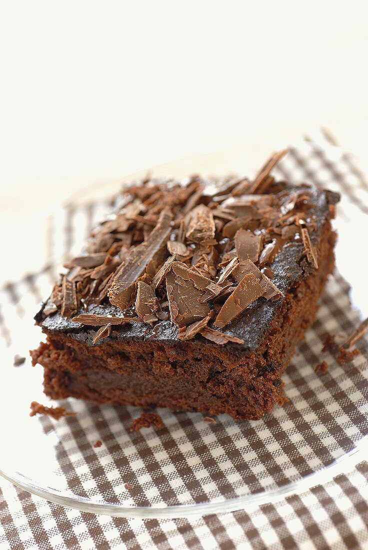 Piece of chocolate cake with chocolate curls