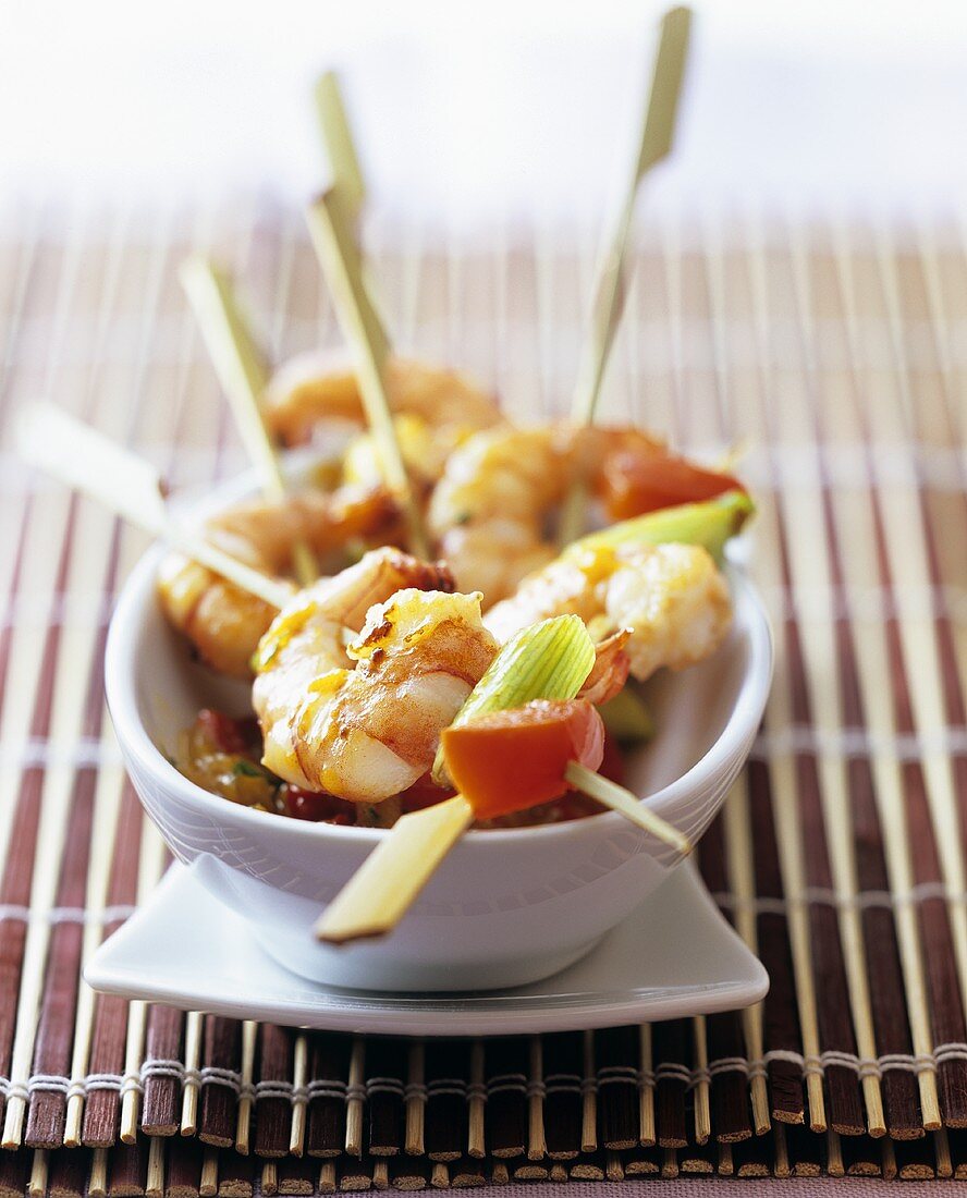 Shrimps on cocktail sticks with spring onions