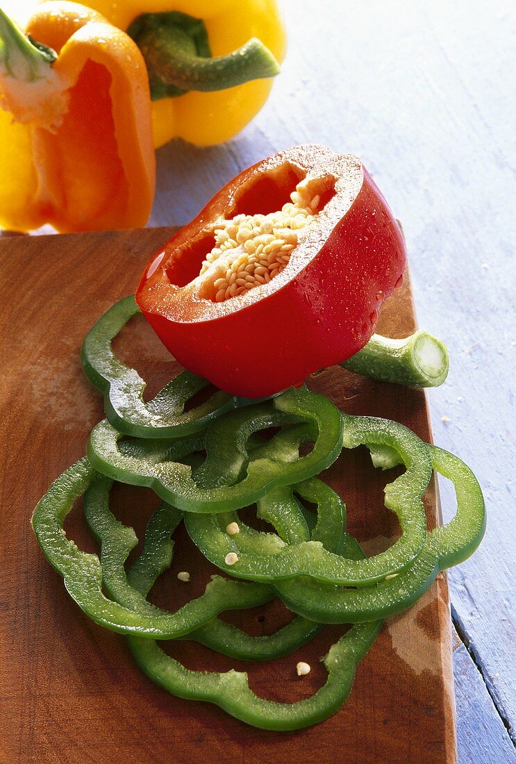 Red, green and yellow peppers, sliced