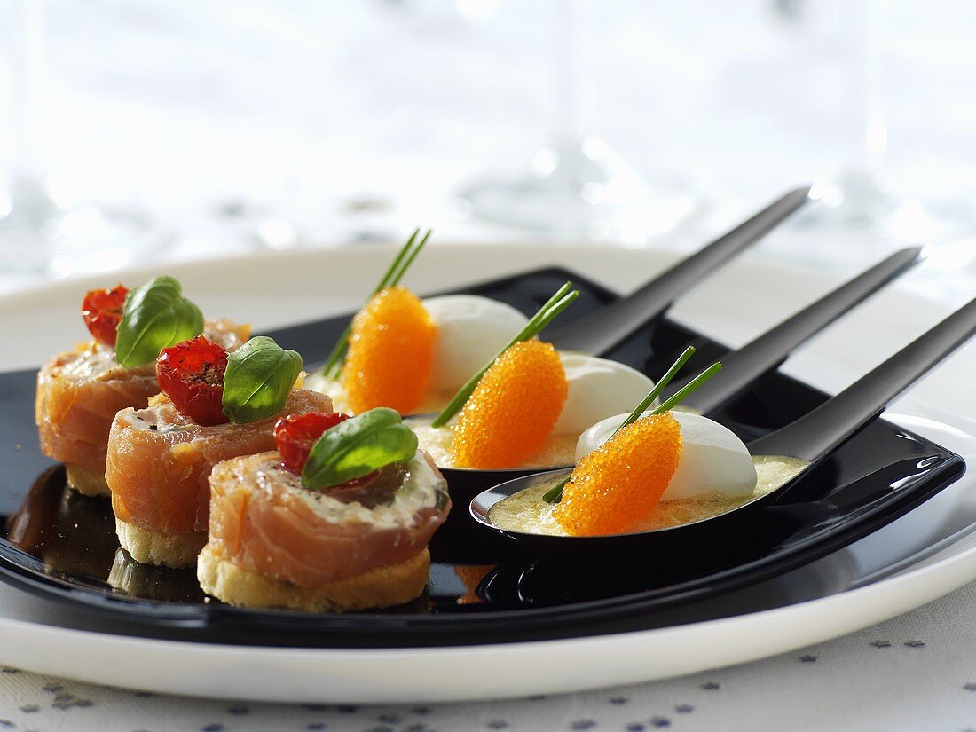 Salmon snacks and fish dumplings with caviar