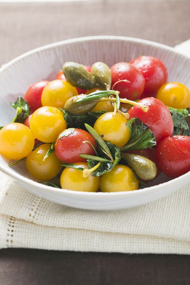 Cherry tomatoes and capers in bowl