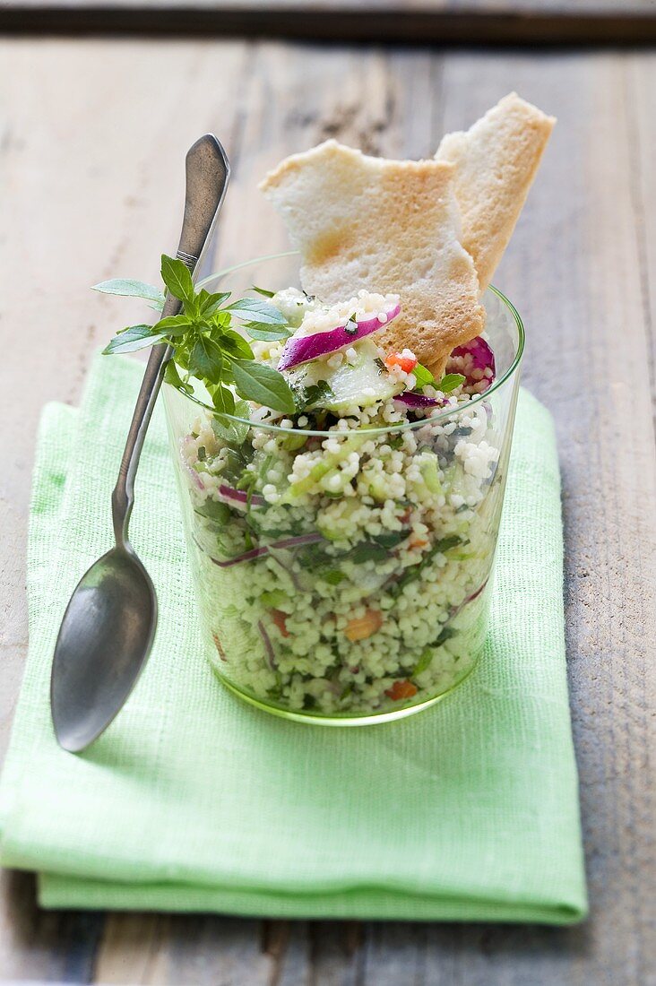 Couscous and vegetable salad in glass