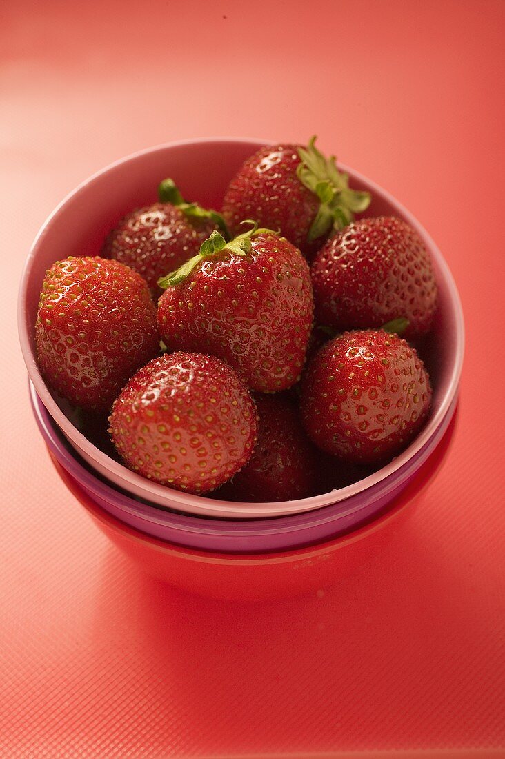 Strawberries in pink bowl