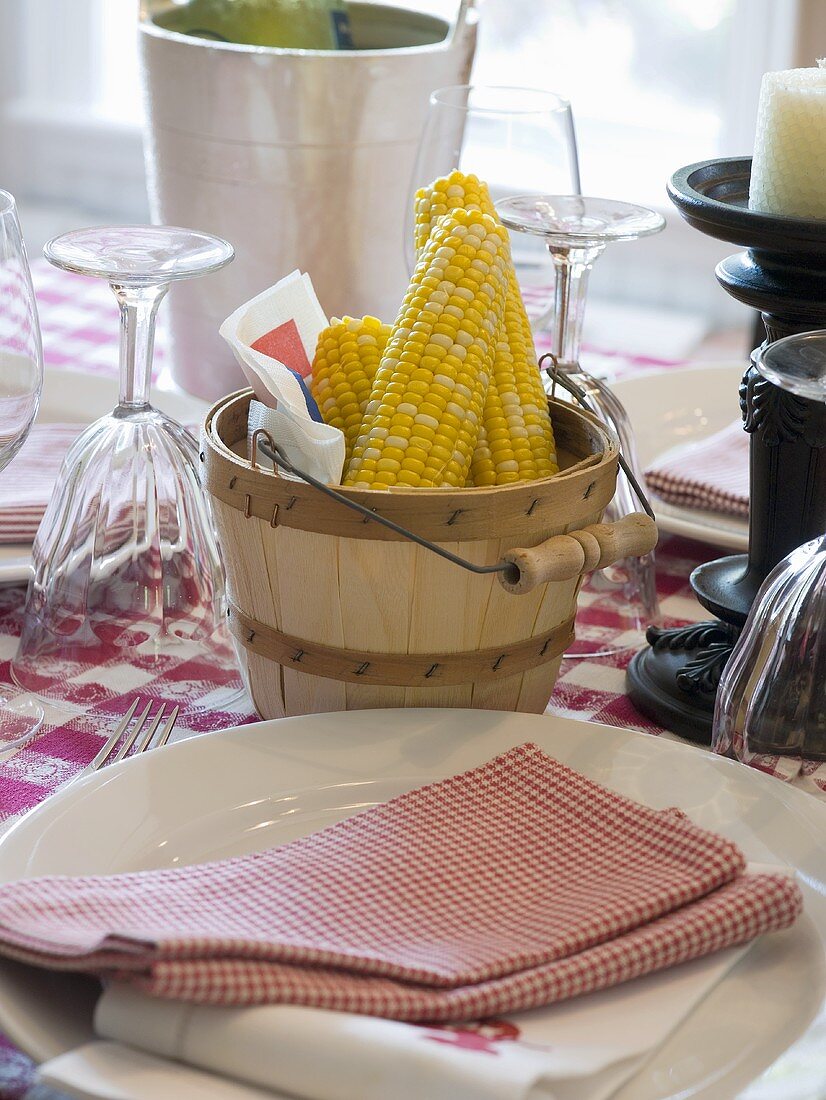 Laid table with corn cobs (USA)