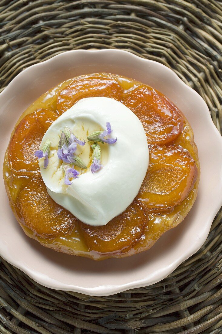 Apricot tart with cream and flowers