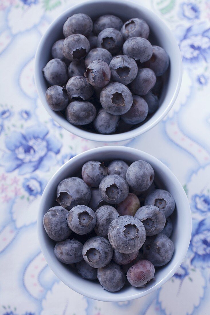 Blueberries in two small bowls