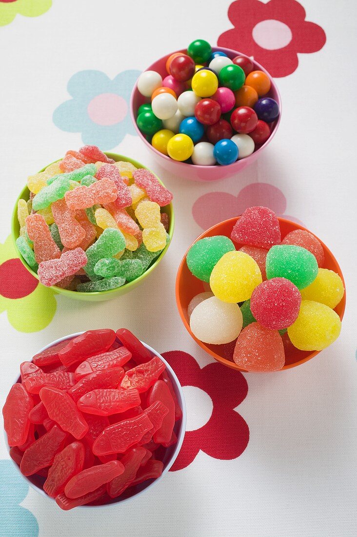 Assorted jelly sweets and bubblegum in bowls