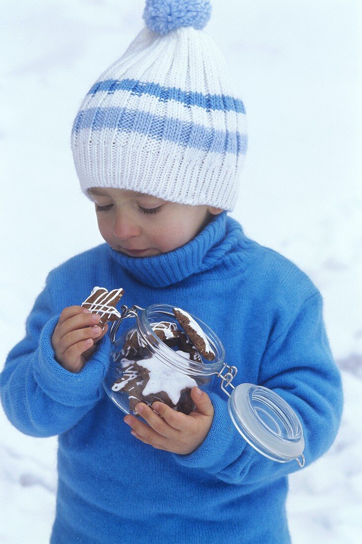 Child eating Christmas biscuits