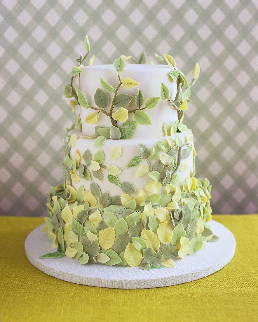 Wedding cake with springtime decoration of sugar leaves