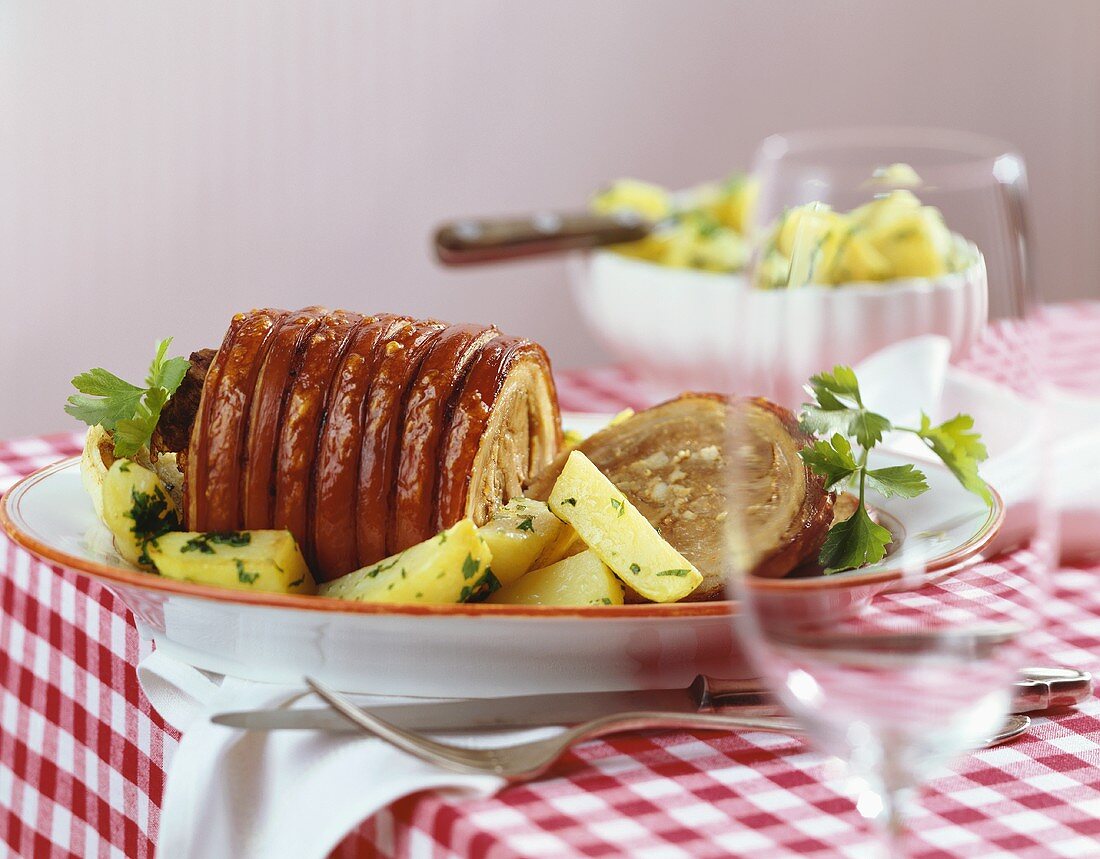 Rolled pork roast with garlic and parsley potatoes