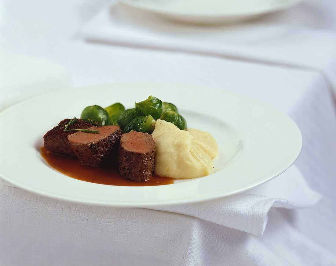 Venison in rose hip sauce with Brussels sprouts & mashed potato