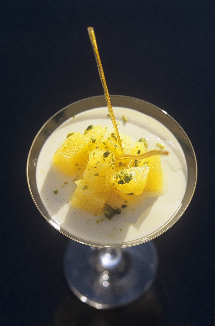 Rice pudding with pineapple and pistachios (overhead view)