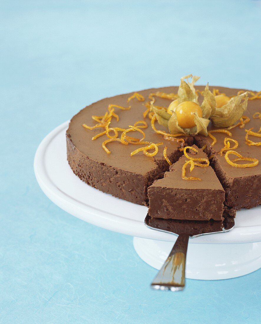 Chocolate cake with physalis and orange zest