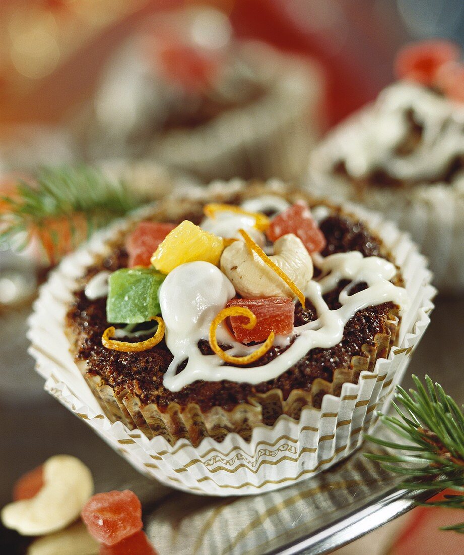 Small cake with candied fruit and nuts for Christmas