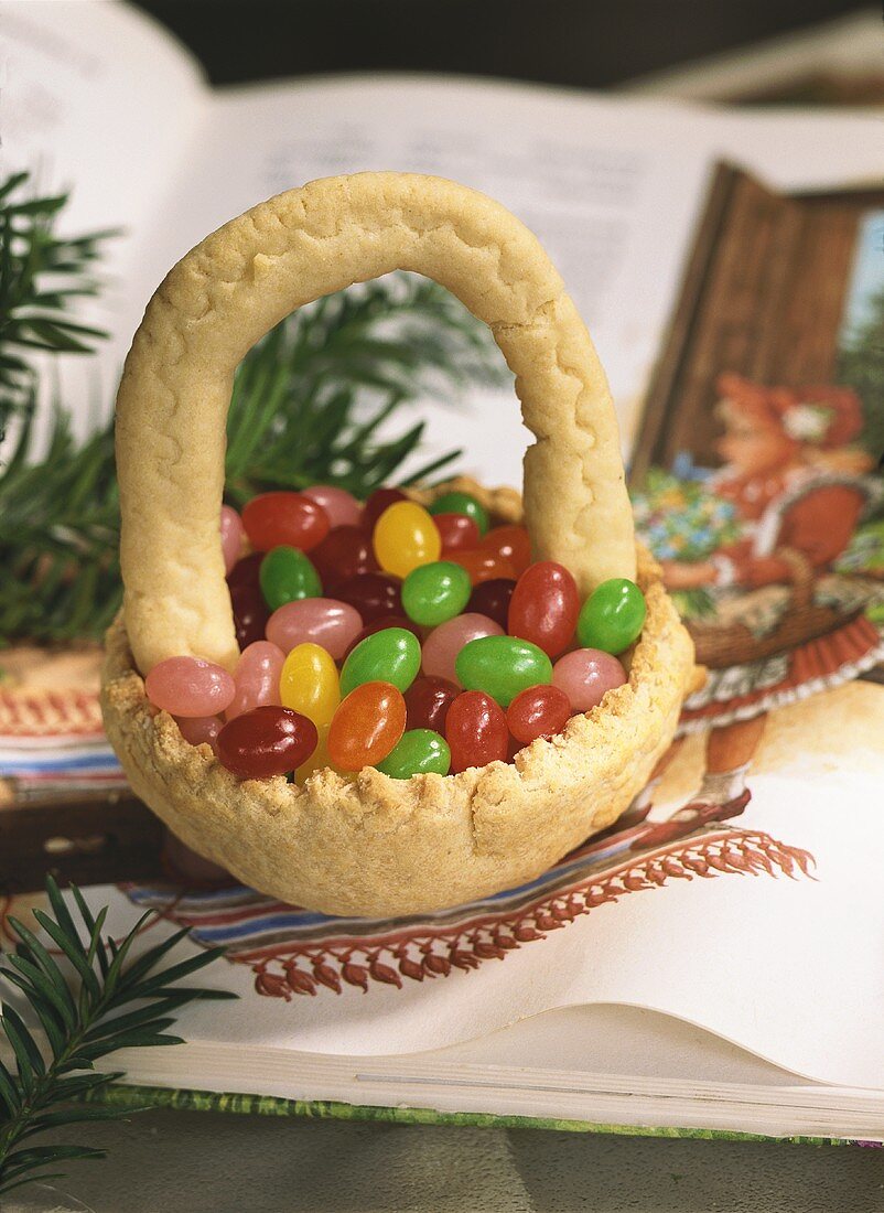 Coloured sugar eggs in baked basket