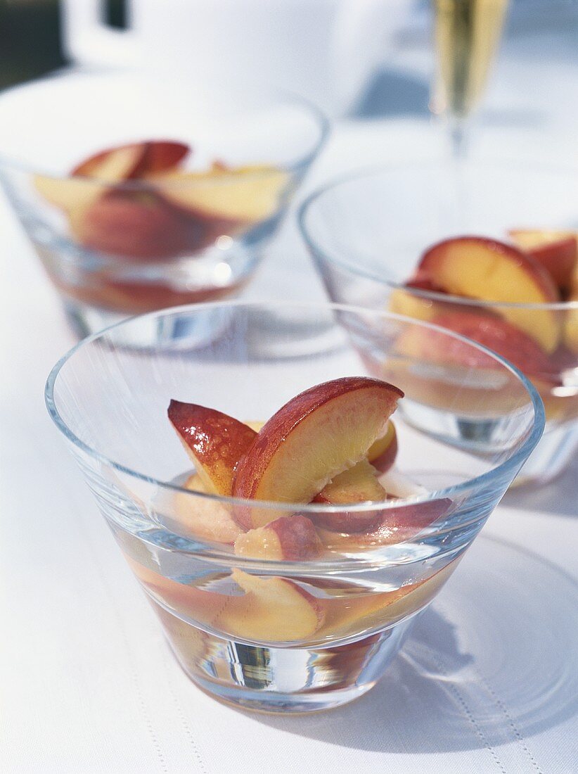 Poached peaches with brandy in syrup