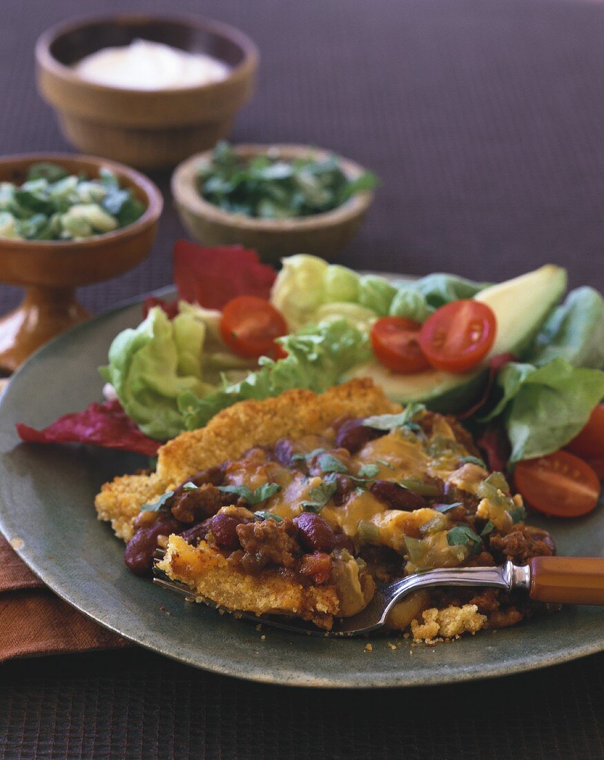 Parmesan schnitzel with red kidney beans and salad