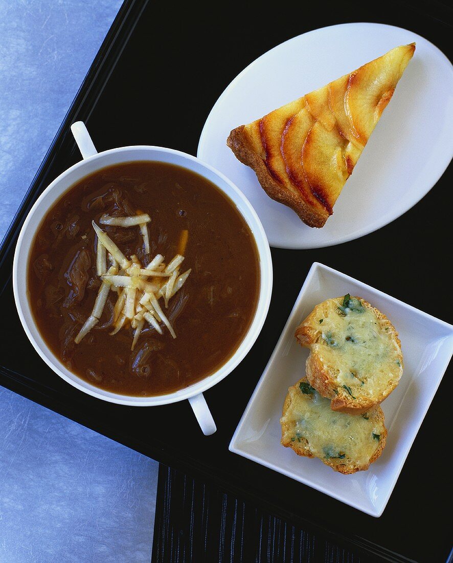 Onion soup, toasted cheese baguettes, piece of apple tart