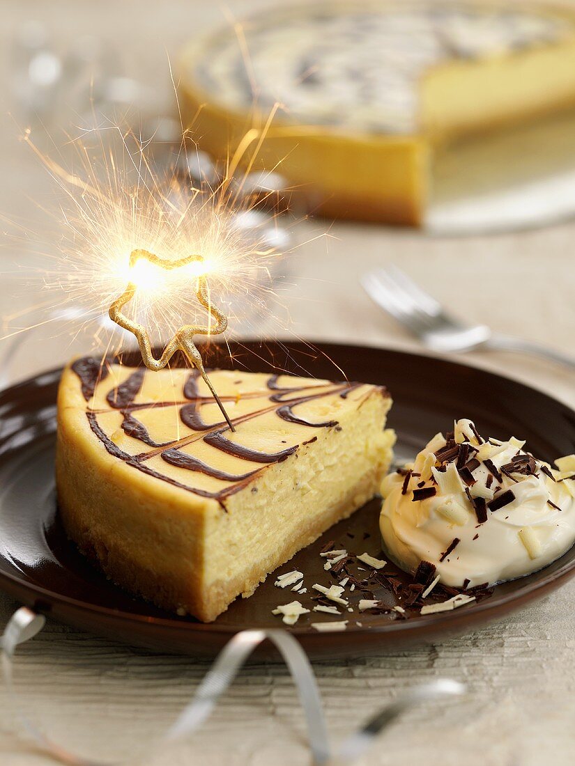 Piece of cheesecake with sparkler