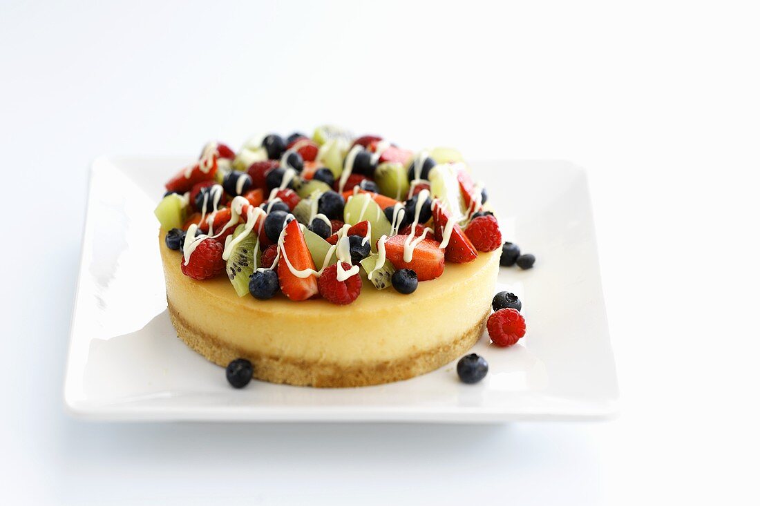 Small cheesecake topped with fruit