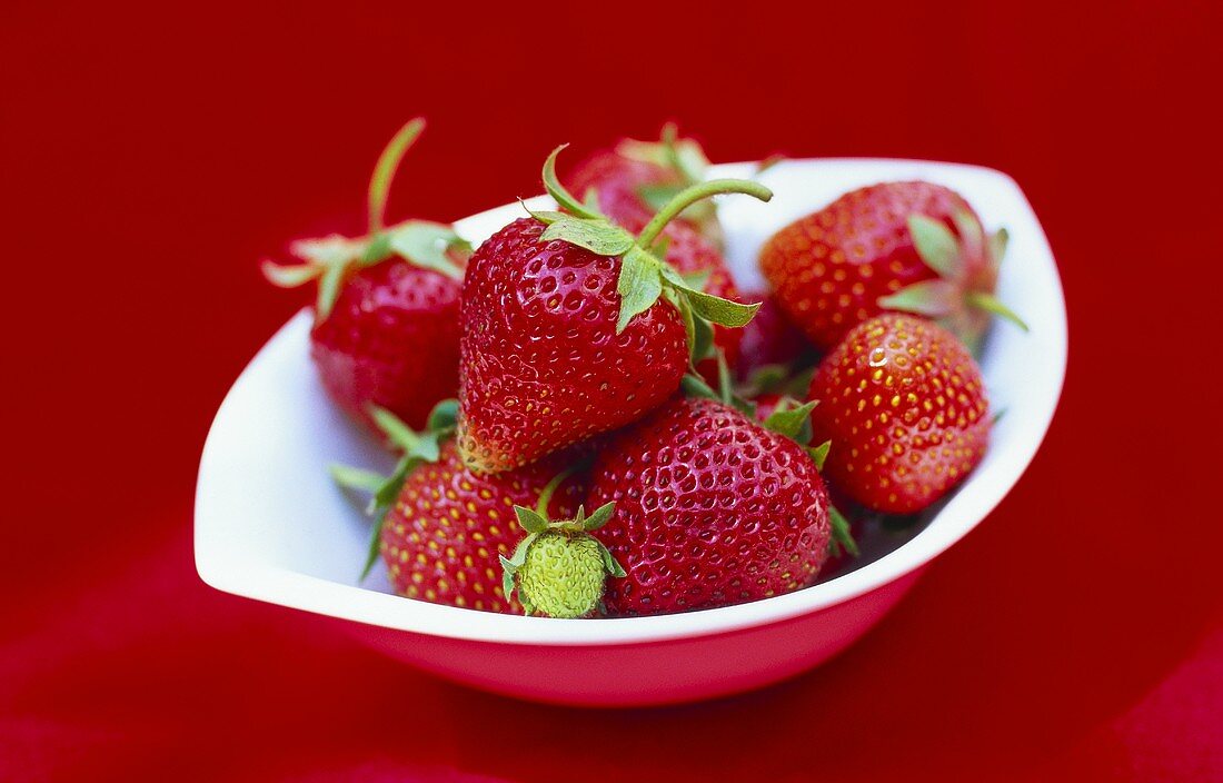 Fresh strawberries in a small bowl