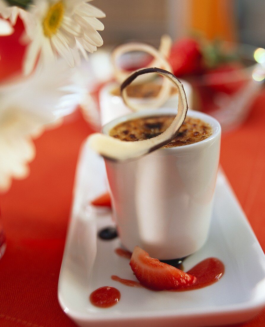 Crème brulee with strawberry jus