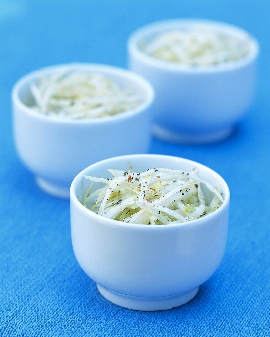 Cabbage salad in three bowls