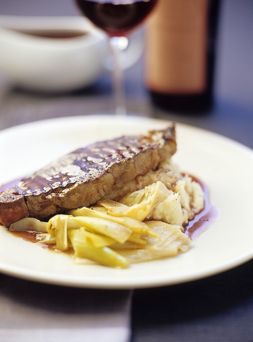 Loin steak with red wine sauce, leeks and parsnip puree