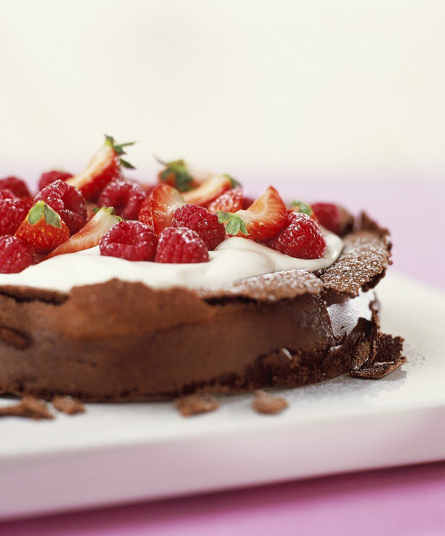 Chocolate cream cake with fresh berries