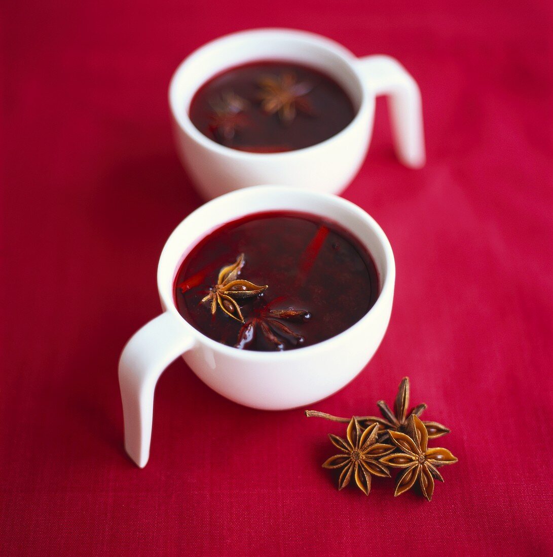 Two cups of mulled wine with star anise