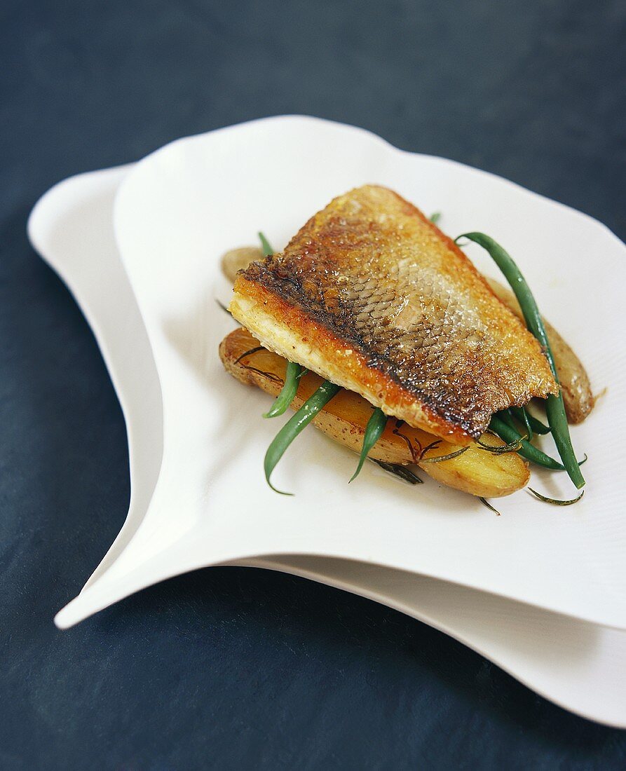 Sea bass with green beans on La Ratte potatoes