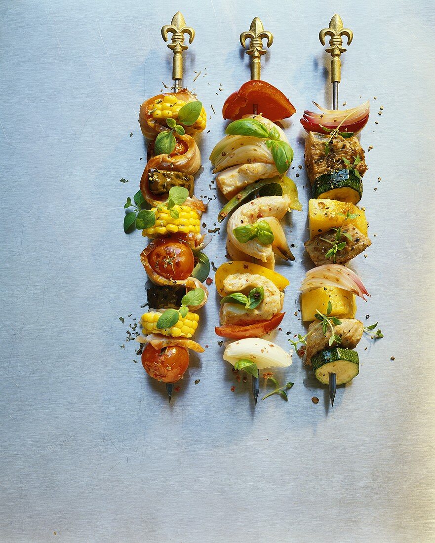 Three skewers with meat and vegetables 