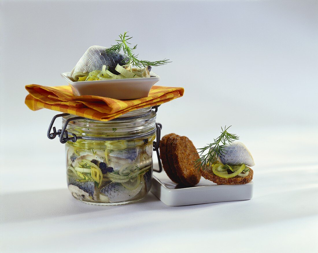 Swedish herring in jar and with pumpernickel rounds