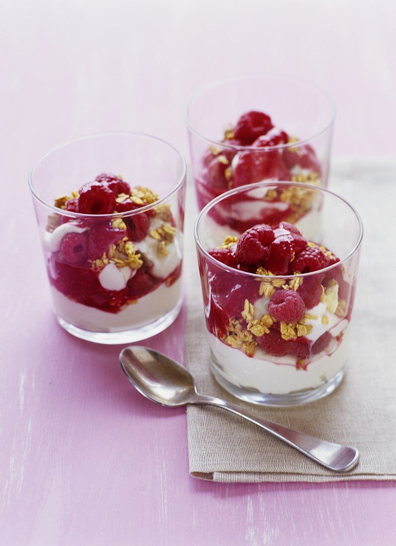 Layered raspberry and yoghurt dessert with muesli