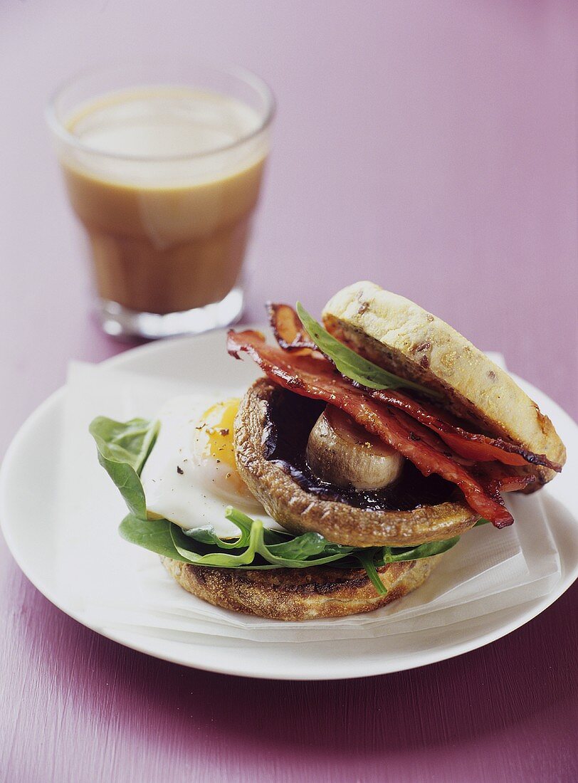 Fried egg, mushroom and bacon in a sandwich
