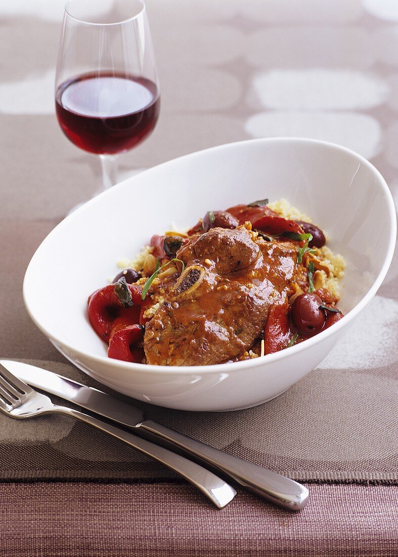 Braised leg of lamb with olives & peppers and couscous