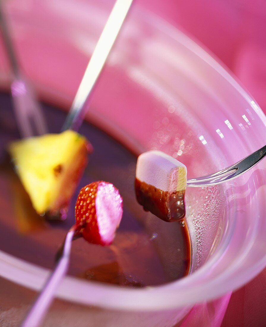 Chocolate fondue with fruit and marshmallow