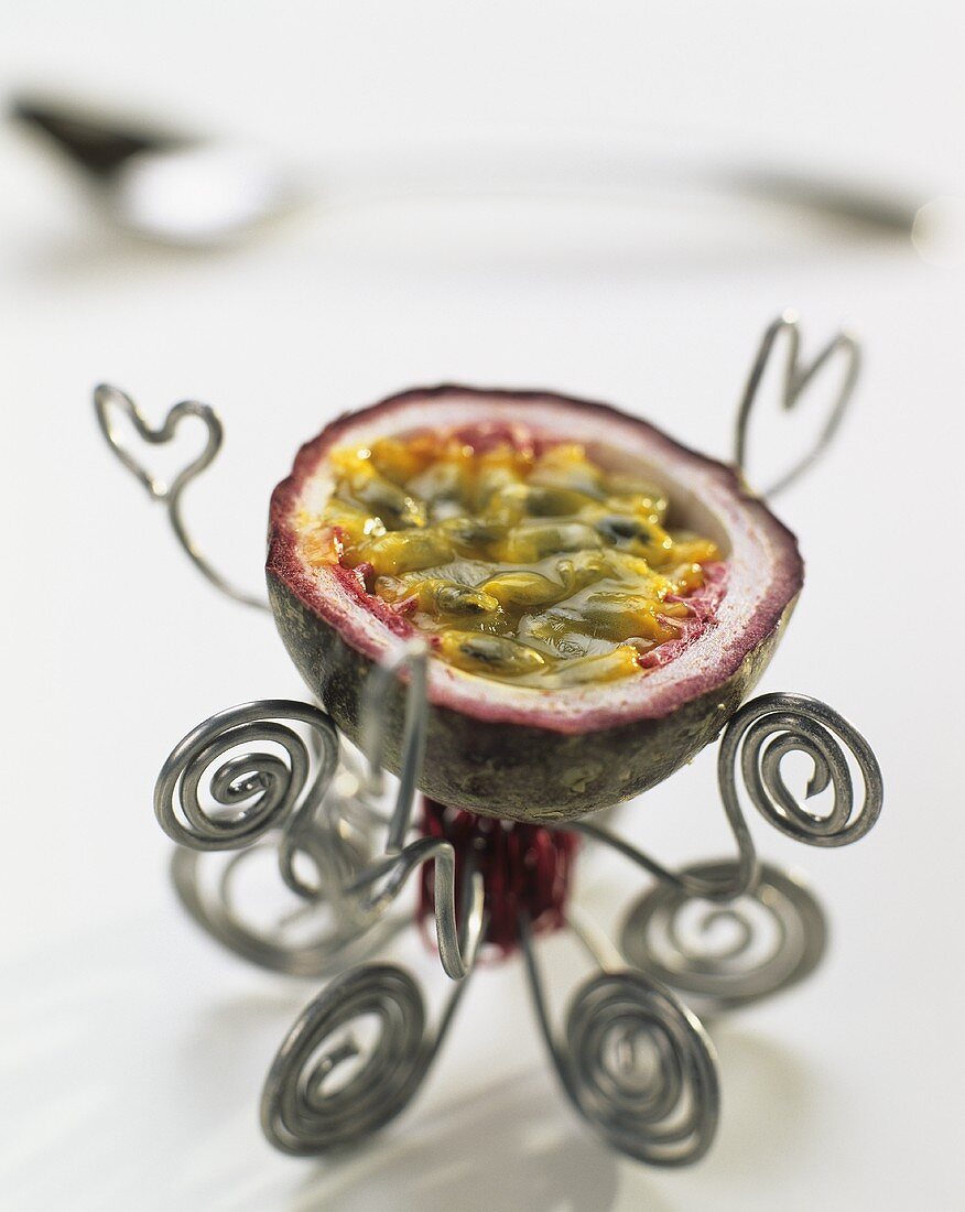 Half a passion fruit on a stand