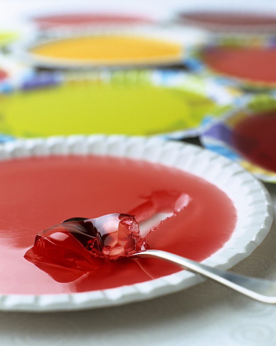 Colourful fruit jellies on plates